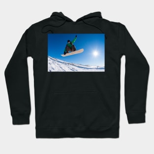 Snowboarder jumping against blue sky Hoodie